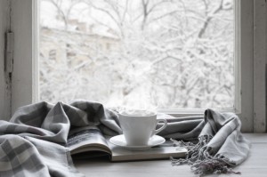 Cup and blanket on windowsill