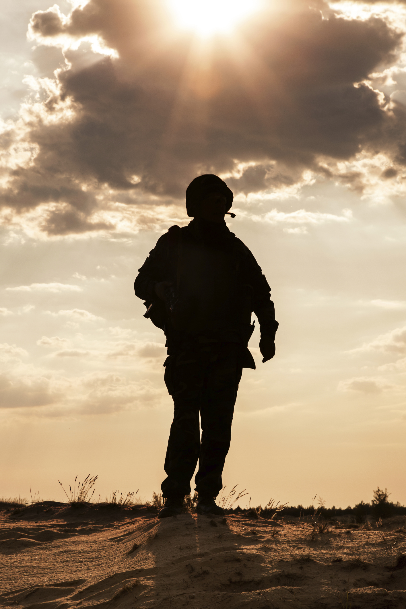 Silhouette of a soldier against the sunset