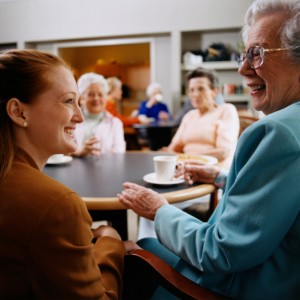 Senior in nursing home visits with family member