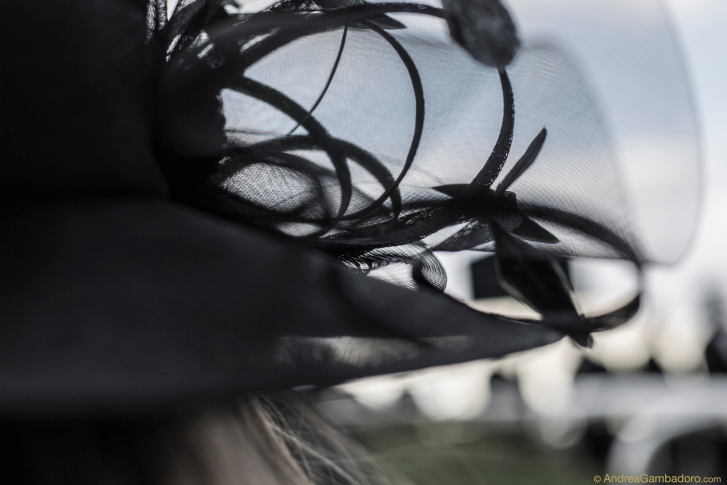 Cropped view of woman wearing fancy black hat with veil