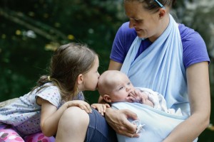 Mother enjoying nature with her daughter and baby