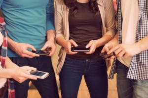 Group of people using smartphones