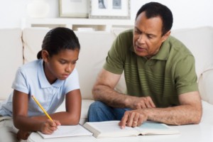 Father helps child with homework
