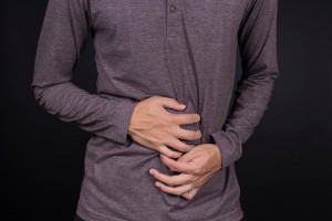 man holding stomach in pain