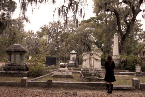 Woman visits her parents' grave
