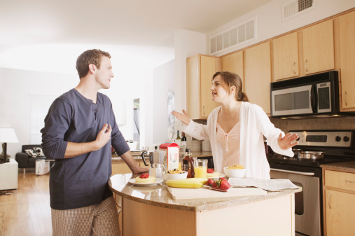 Couple arguing in kitchen
