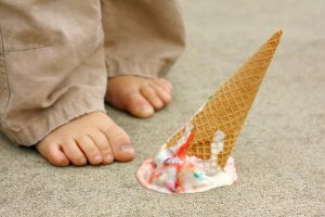 fallen ice cream cone by feet