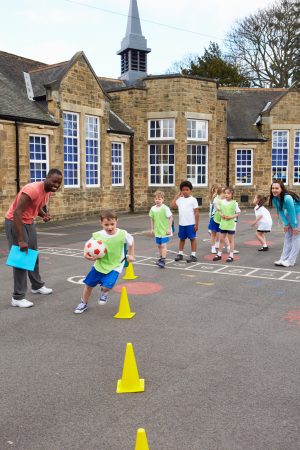 Children playing game outside school