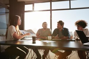 Woman presenting project to colleagues