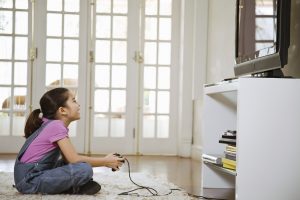 Young girl playing video games