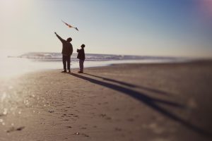 flying a kite on the beach