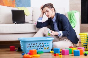 parent surrounded by toys