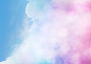 An abstract cloudscape with pink bokeh effects.