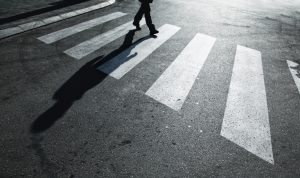 walking across road with shadow