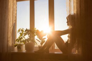 Sitting on windowsill watching the sun rise