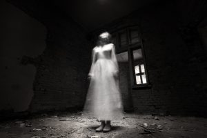 ghostly figure in white dress