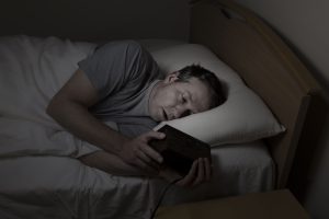Man having difficulty sleeping