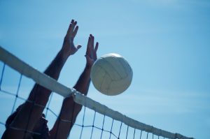 beach volleyball block at net