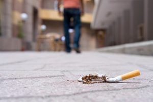 figure walking away from cigarette