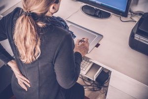 Woman at work with lower back pain
