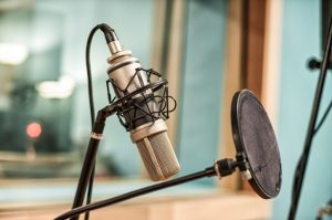 Microphone and pop filter in recording studio