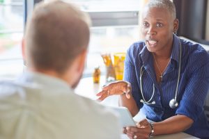 Doctor talking with patient
