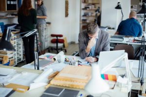 Man feeling stressed at work
