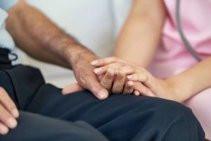 Nurse comforting patient