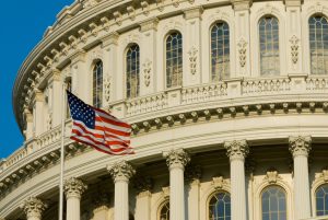 American flag in front of the capitol building