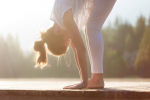 Woman stretching on dock