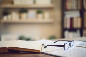 glasses and books in empty study