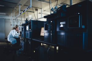 Researcher looking at data on computer screen