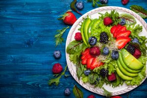 Fruit salad on blue surface
