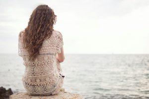 Woman looking out toward the sea