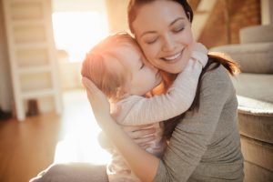 Close up of a mother and daughter having fun at home