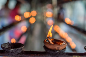 Coconut oil lit in temple