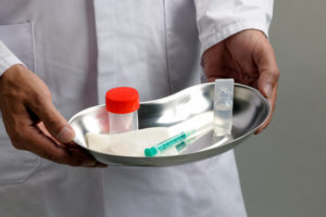 Health care professional holds materials prepped for vaccine