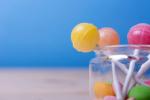 Close-up of lollipops in a jar.
