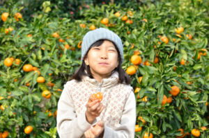 Savoring the taste of an orange outside