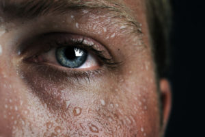 Close-up of a flushed, sweaty face.