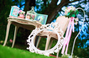 Low-angle shot of a stylized mirror and tea table