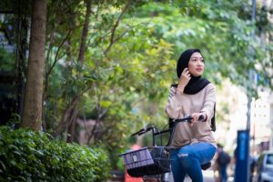 Woman riding a bicycle looking into the distance