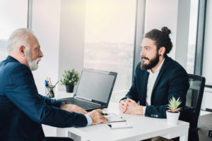 Job interview between old and young man