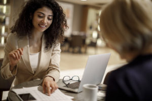 Peer support specialist goes over documents with a client