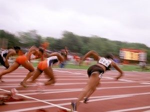 Racers sprint on a track