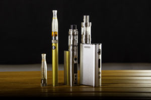 vape devices and electronic cigarette, ecig and mods over a black background.