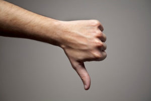 Thumbs down with grey background