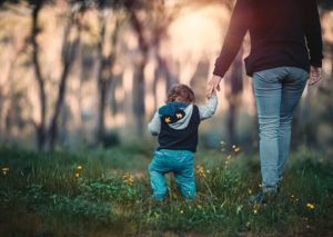 Walking with parent at sunrise