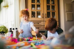 Small children doing arts and crafts