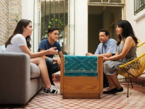 Teens talking at home with parents